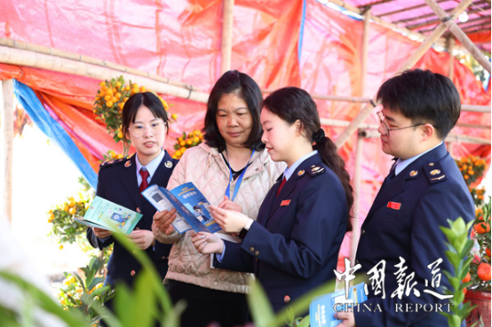 中国报道：税宣添彩迎春花市 政策春风暖人心田
